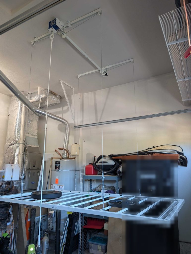 Ceiling storage lift installed in a Hillsboro garage, platform lowered